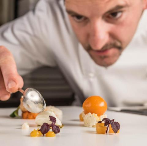 Peter Girtler is preparing a dish