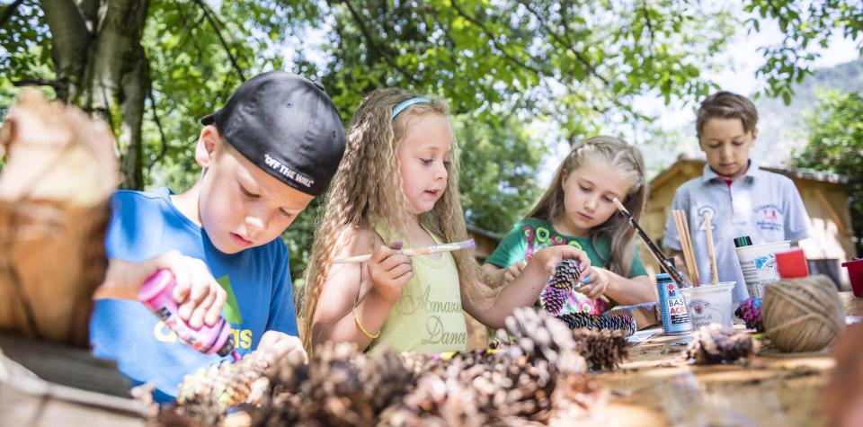 Children are painting with acrylic paints
