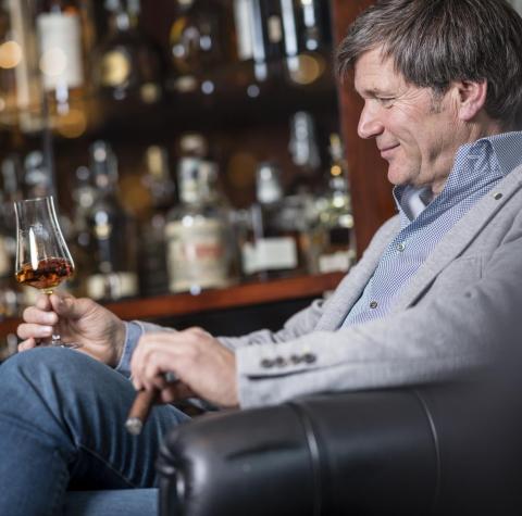 A man is drinking a liqueur at Hotel Stafler