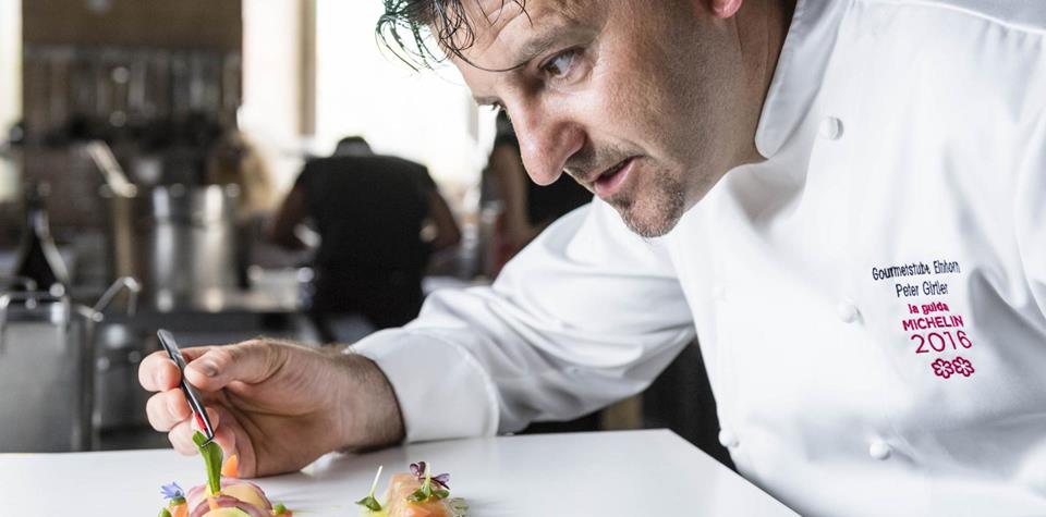 Peter Girtler is preparing a dish