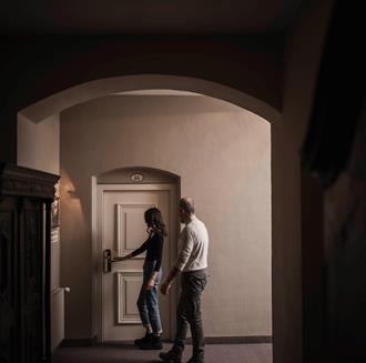 A man and a woman in the Stafler Hotel