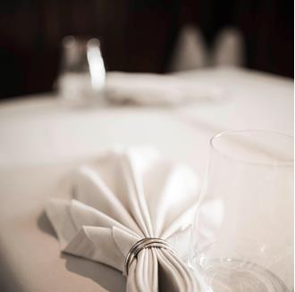 A folded napkin lies on a table